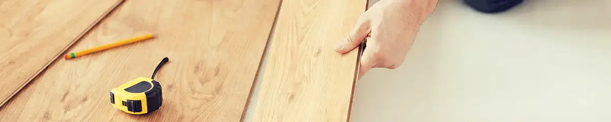 A professional installing wood flooring in Fort Lauderdale, FL
