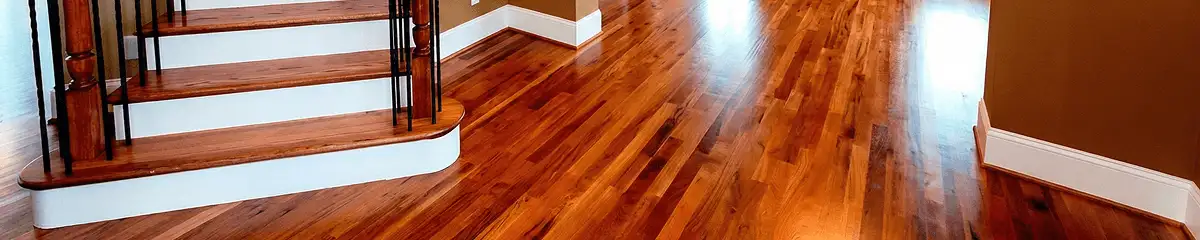 Base floor of a staircase with professionally restored wood flooring in Fort Lauderdale FL
