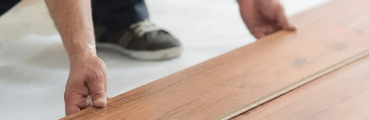 A professional installing laminate flooring in Fort Lauderdale, FL
