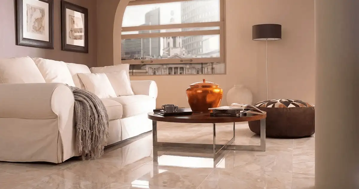 Modern living room with professionally installed marble flooring, a beige sofa, coffee table in Fort Lauderdale, FL